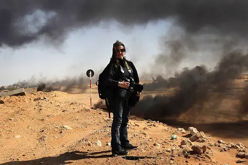 Woman Photographer In War Country